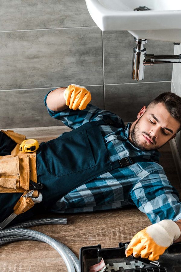bearded-handyman-lying-on-floor-near-toolbox-in-ba-resize.jpg